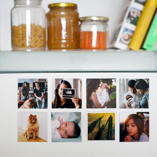 Eight custom square photo magnets arranged on a fridge